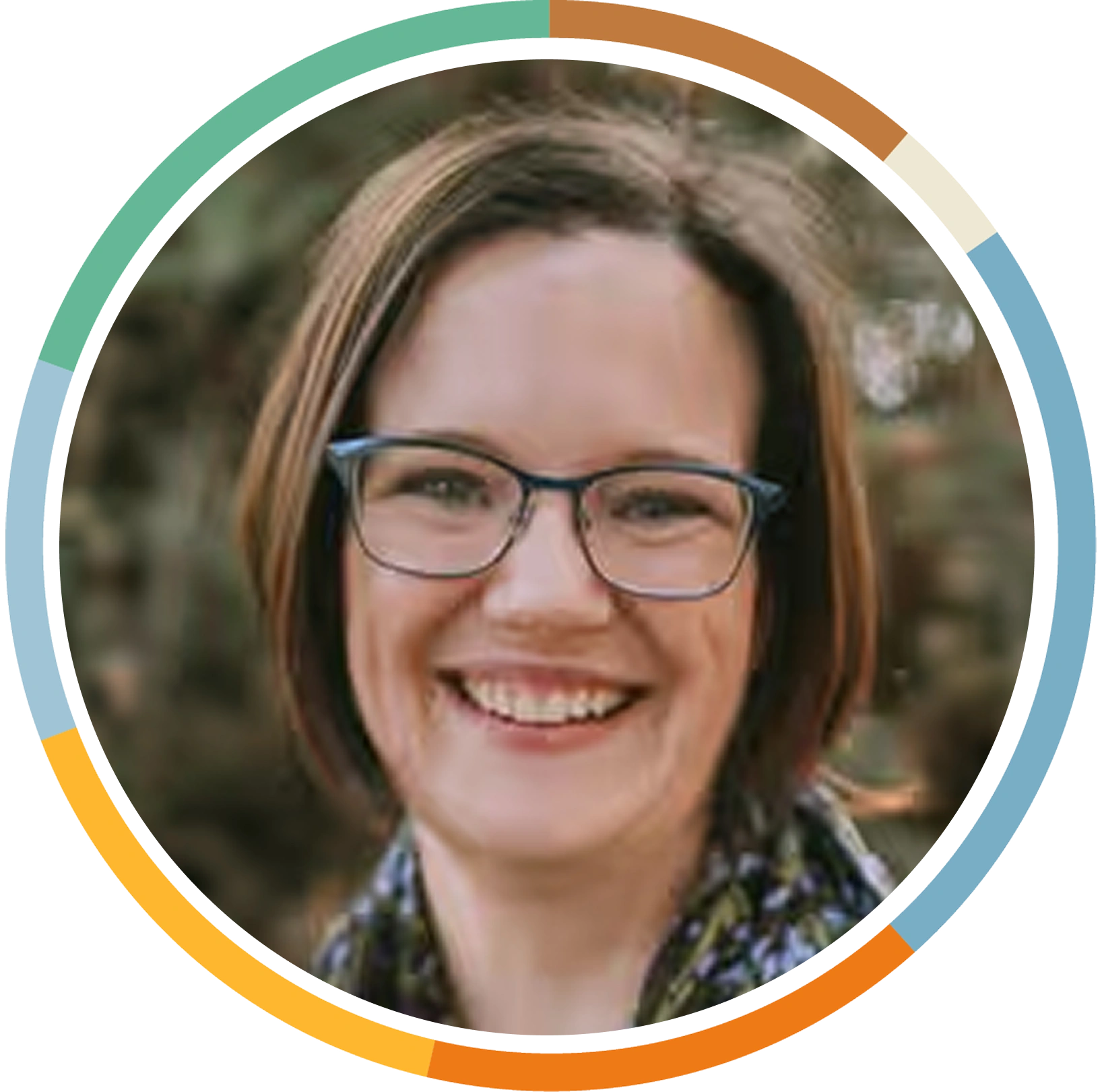 Michele Darling, LPC CEO & Research Director, headshot within multicolored circle